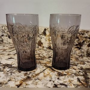 Set of 2 purple/brown Coca-cola Drinking glasses.